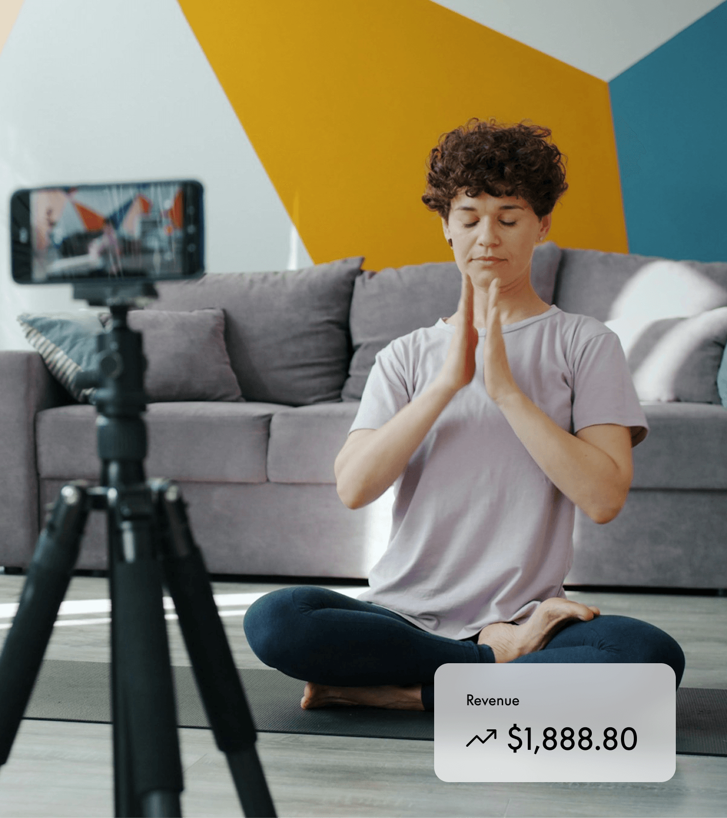 Woman recording herself for an online yoga class